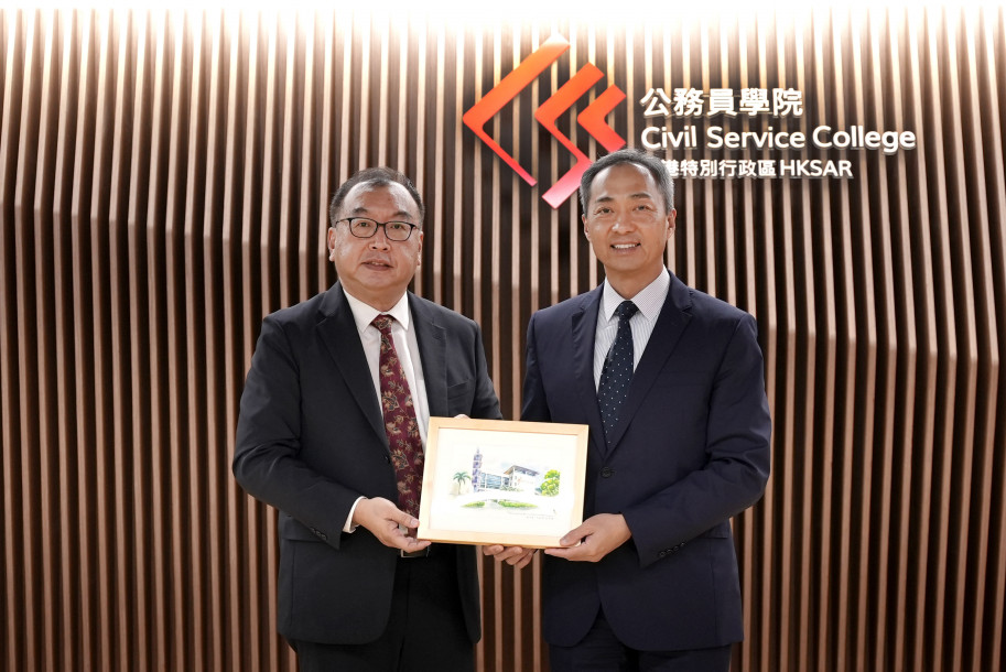 The Head of the Civil Service College, Mr Oscar Kwok, meets with a delegation led by the Assistant CEO (International) of the Civil Service College of Singapore, Mr Roger Tan, at the Civil Service College on 16 May 2024.  Mr Kwok (right) is pictured with Mr Tan (left).